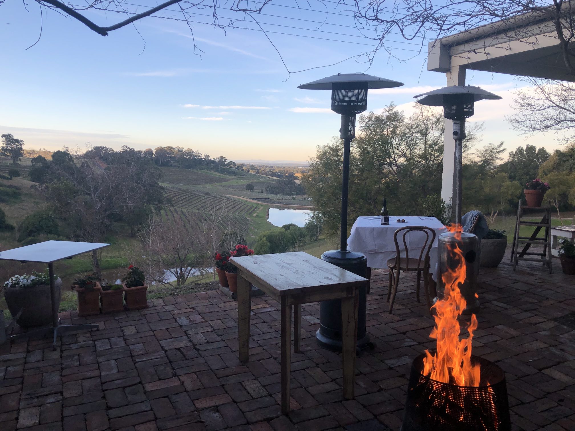 Open fire, looking out over vineyards in the valley below.